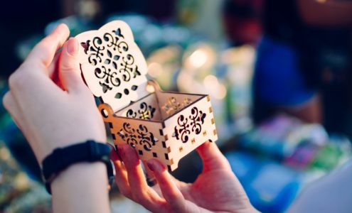 woman opens empty cut-out box