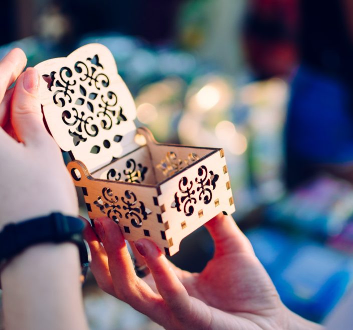 woman opens empty cut-out box