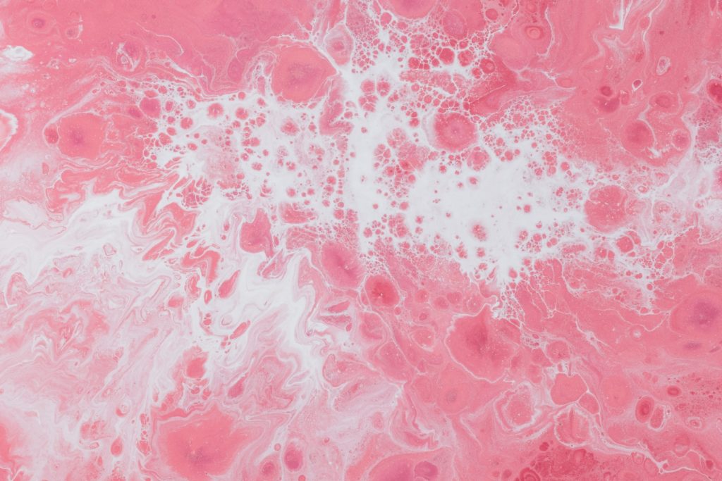 pink and white fluid abstract painting