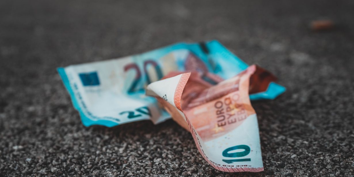 10 and 20 banknotes on concrete surface