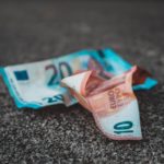 10 and 20 banknotes on concrete surface