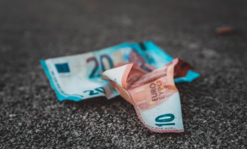 10 and 20 banknotes on concrete surface